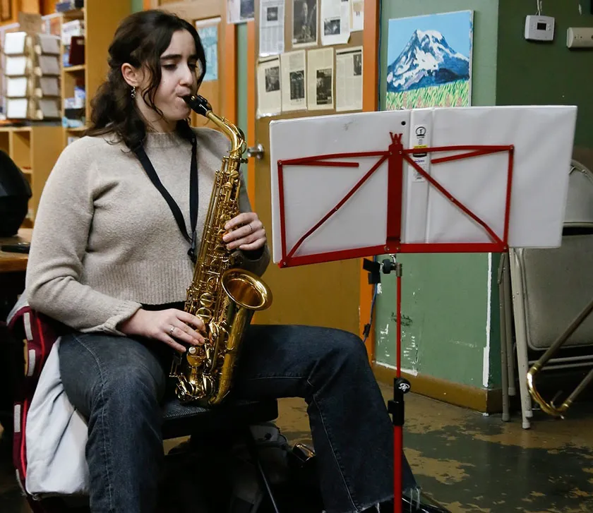 woman playing saxophone at a klezmer jam